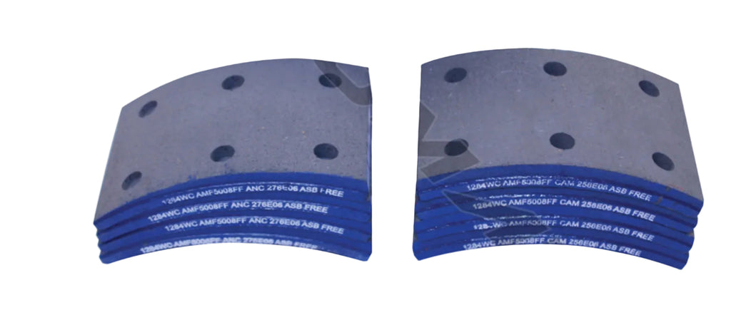 Automann 140.1284WC.50 brake lining showing friction surface and mounting edge for vehicle brake system.