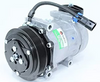 Automann 830.31005 air conditioning compressor 7H15 type, showing the compact metallic body and connection ports for vehicle AC system
