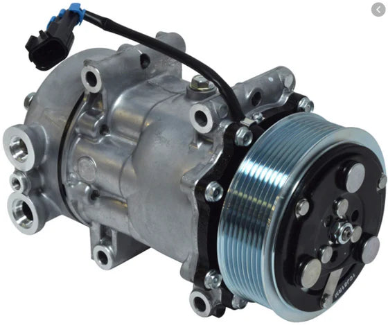Automann 830.31006 air conditioning compressor 7H15 type, showing the metal body and mounting brackets of the automotive air compressor.