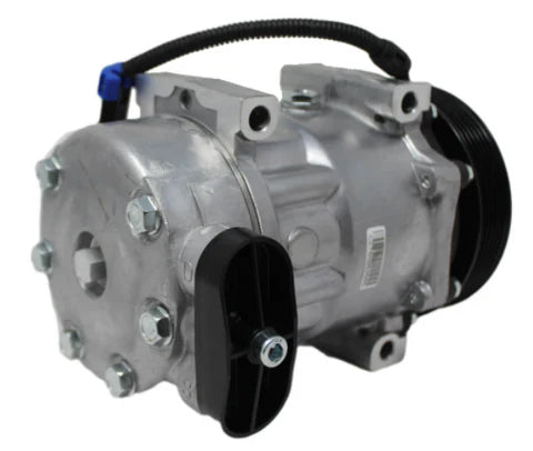 Automann 830.31007 air conditioning compressor 7H15 type, showing the metal body and connection ports with detailed components.