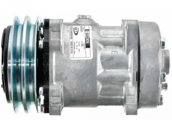 Automann 830.31010 air conditioning compressor 7H15 type, showing the metal compressor component with detailed fittings and labels.