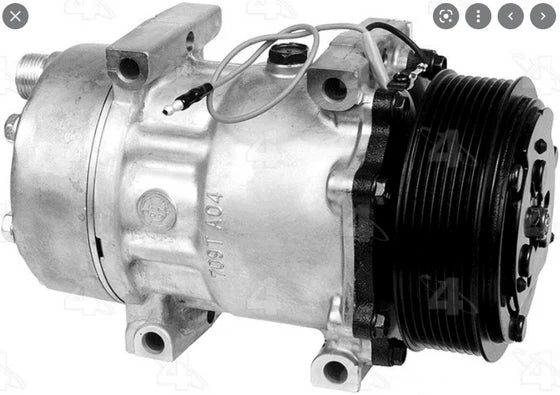 Automann 830.31011 air conditioning compressor 7H15 type showing metallic body and pulley for vehicle HVAC system