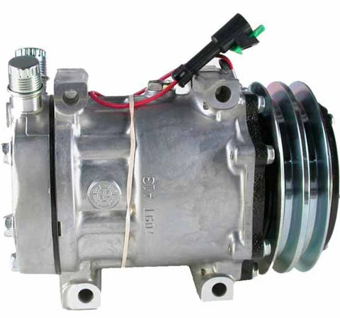 Automann 830.31014 air conditioning compressor 7H15 type, showing the compact metallic compressor unit with inlet and outlet ports.