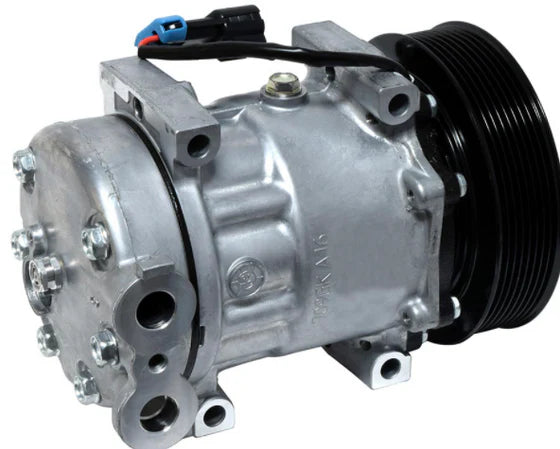 Automann 830.31029 air conditioning compressor 7H15 type, showing the metallic component with detailed fittings and fins.