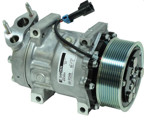 Automann 830.31035 air conditioning compressor 7H15 type, showing the metallic cylindrical component with mounting points.