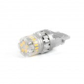 Automann 3157 white LED replacement bulbs, two-pack, for automotive lighting, shown installed in vehicle tail light.