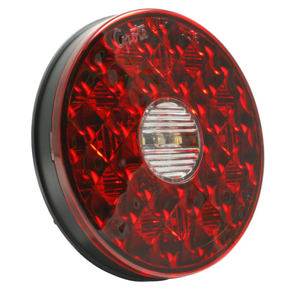 Automann 571.LD40RW14-S/T/T back-up LED light and 4-inch lighting fixture with red and white LEDs, mounted on a vehicle.