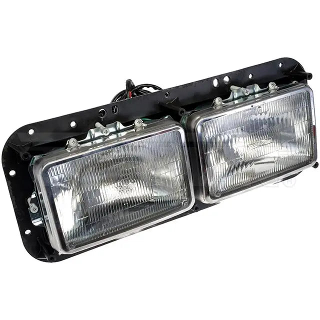 Dayton right headlight assembly with clear lens and mounting brackets, designed for vehicle lighting replacement.