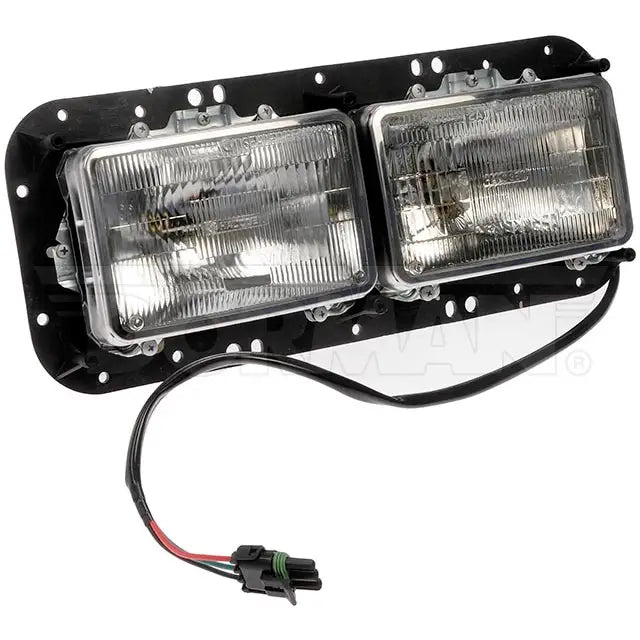 Dayton left headlight assembly with clear lens and black housing, designed for vehicle headlight replacement.