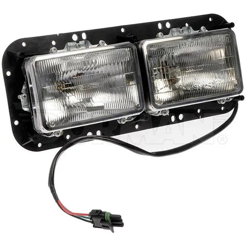 Dayton left headlight assembly with clear lens and black housing, designed for vehicle headlight replacement.